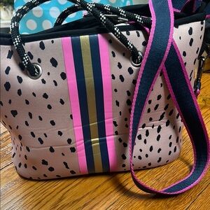 Neoprene zip top bag in animal print with bold pink and navy details